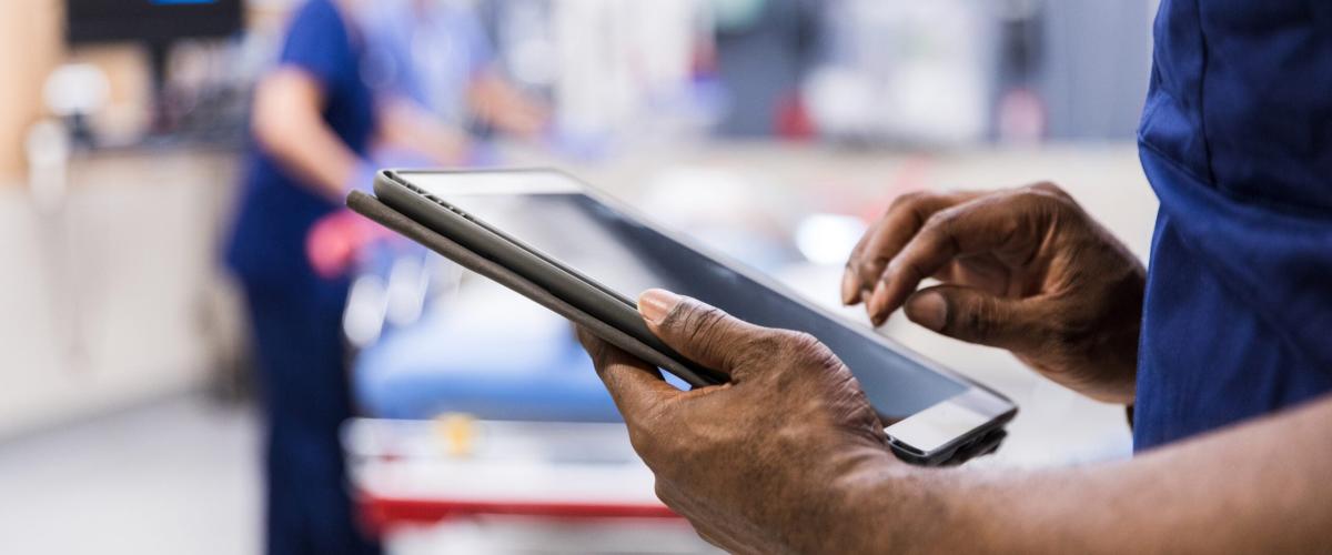 Person holding a tablet