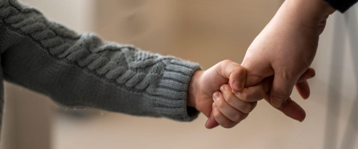 child-hand-hold-feat