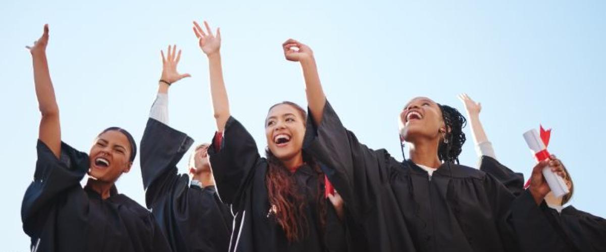 Graduates throwing hats in the air