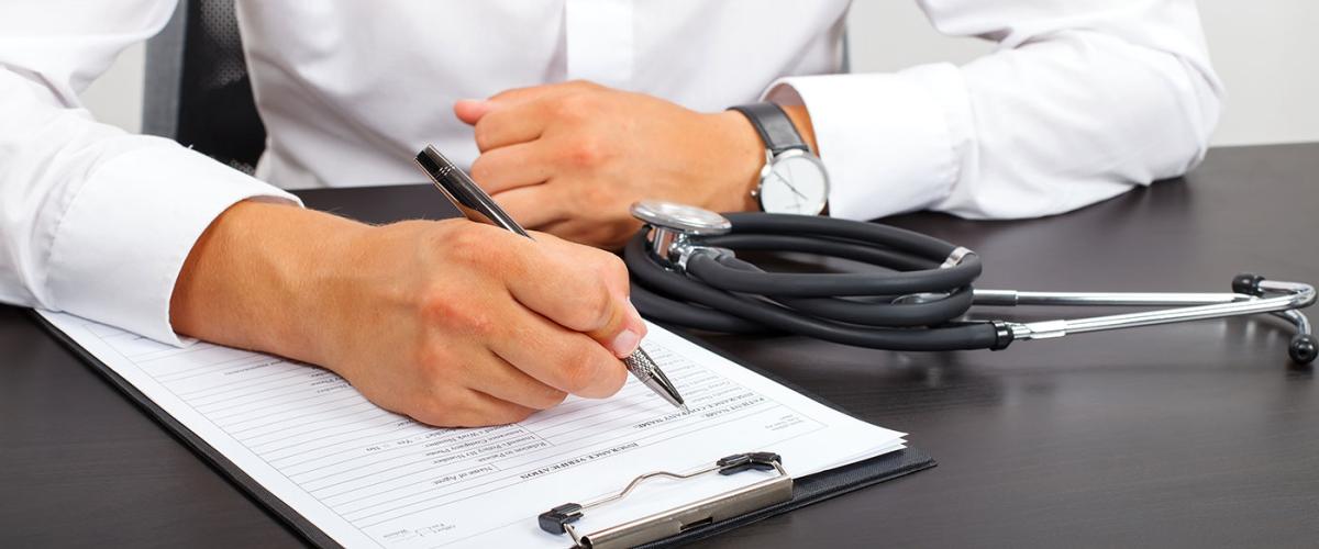 doctor-filling-out-paperwork