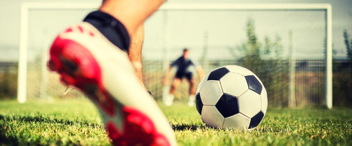 soccer-player-kicking-ball