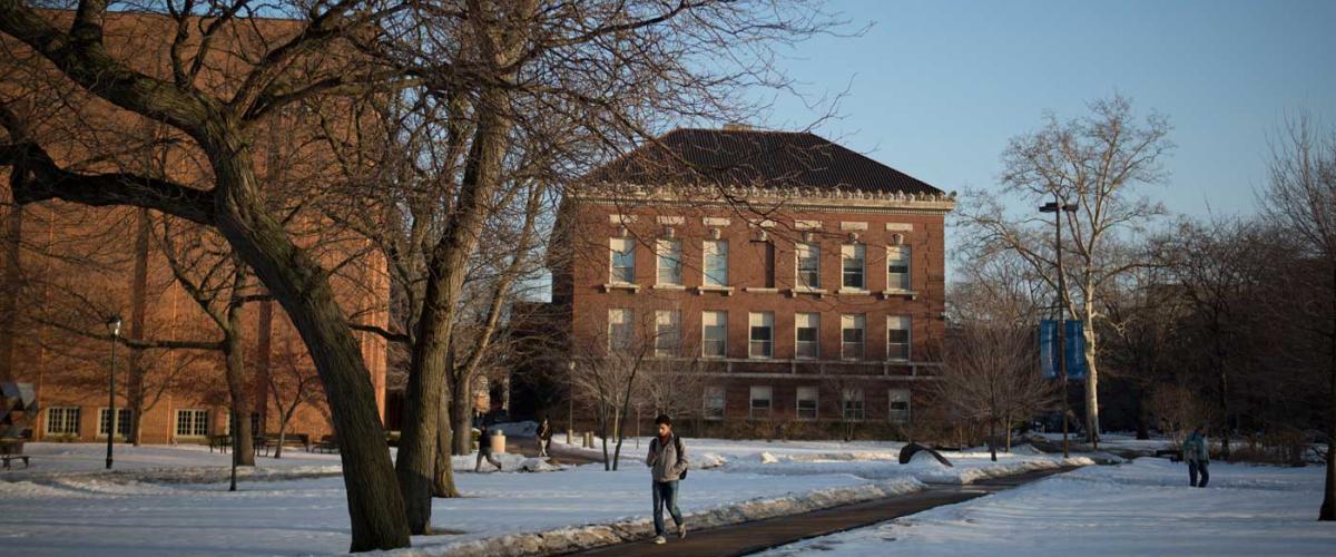 student-walking-snow-feat