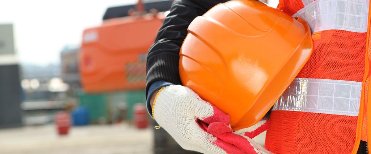 worker-holding-construction-helmet