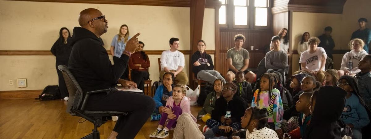 Kwame Alexander, a best-selling author and Emmy-winning producer, read to elementary-school children and Case Western Reserve students participating in the Book Buddies program that CWRU faculty member Cara Byrne leads. The university’s Baker-Nord Institute for the Humanities organized this campus event when it brought Alexander to campus for Awe, the Cleveland Humanities Festival held in 2024.