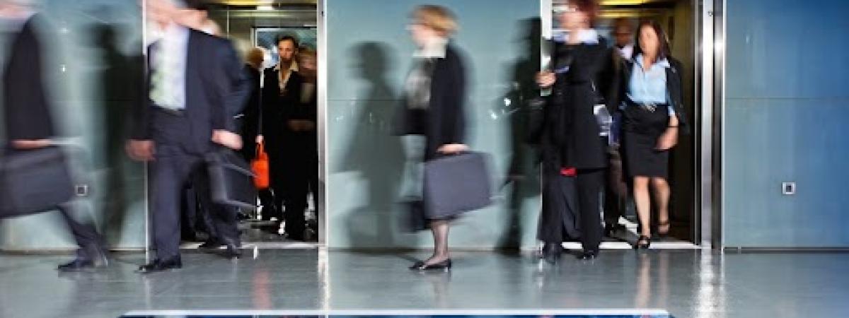 Business people walking through office.