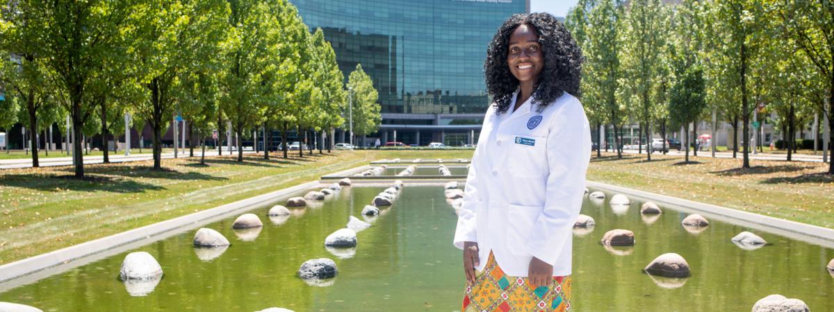 Photo of Akua Abrah in front of Cleveland Clinic