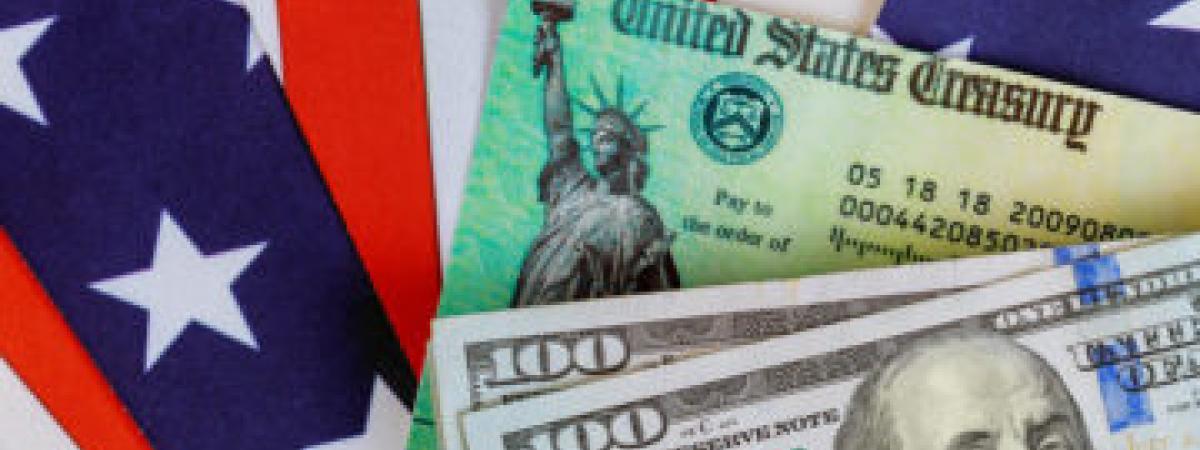 U.S. money on top of U.S. flag