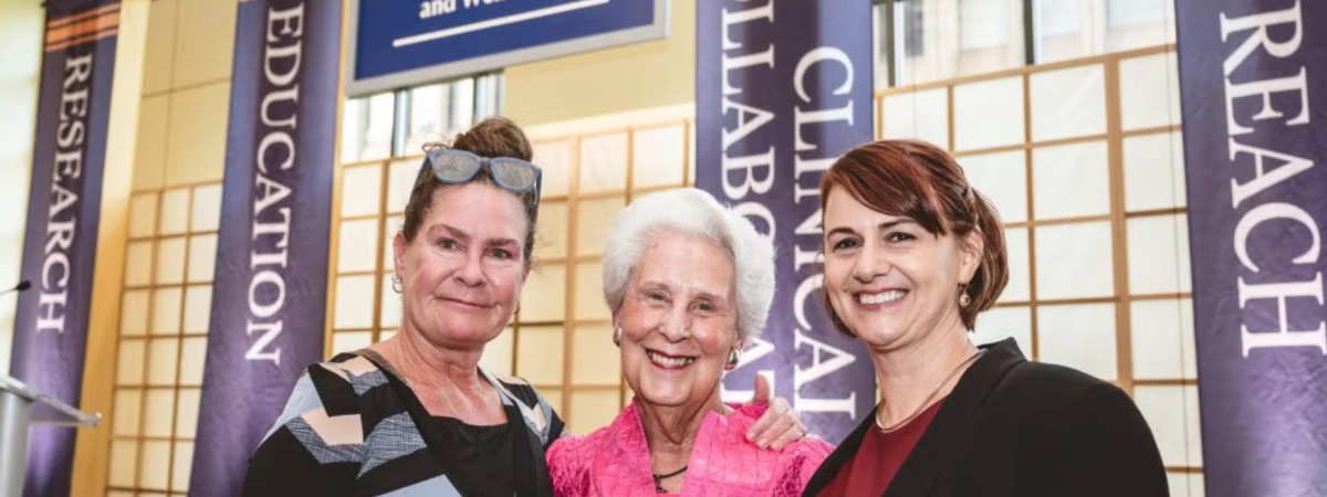 Norah Feeny, Sara Moll and Provost Joy Ward pose for a photo