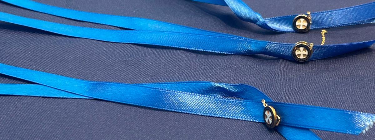 Frances Payne Bolton School of Nursing nursing pins on blue ribbons