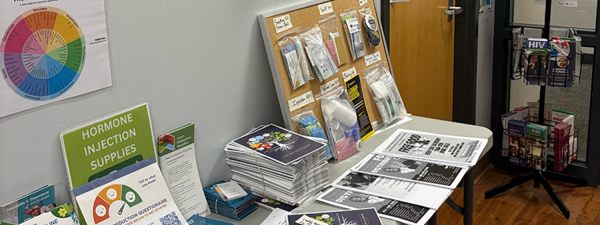 A table of syringe services and drug information and supplies at The Centers.