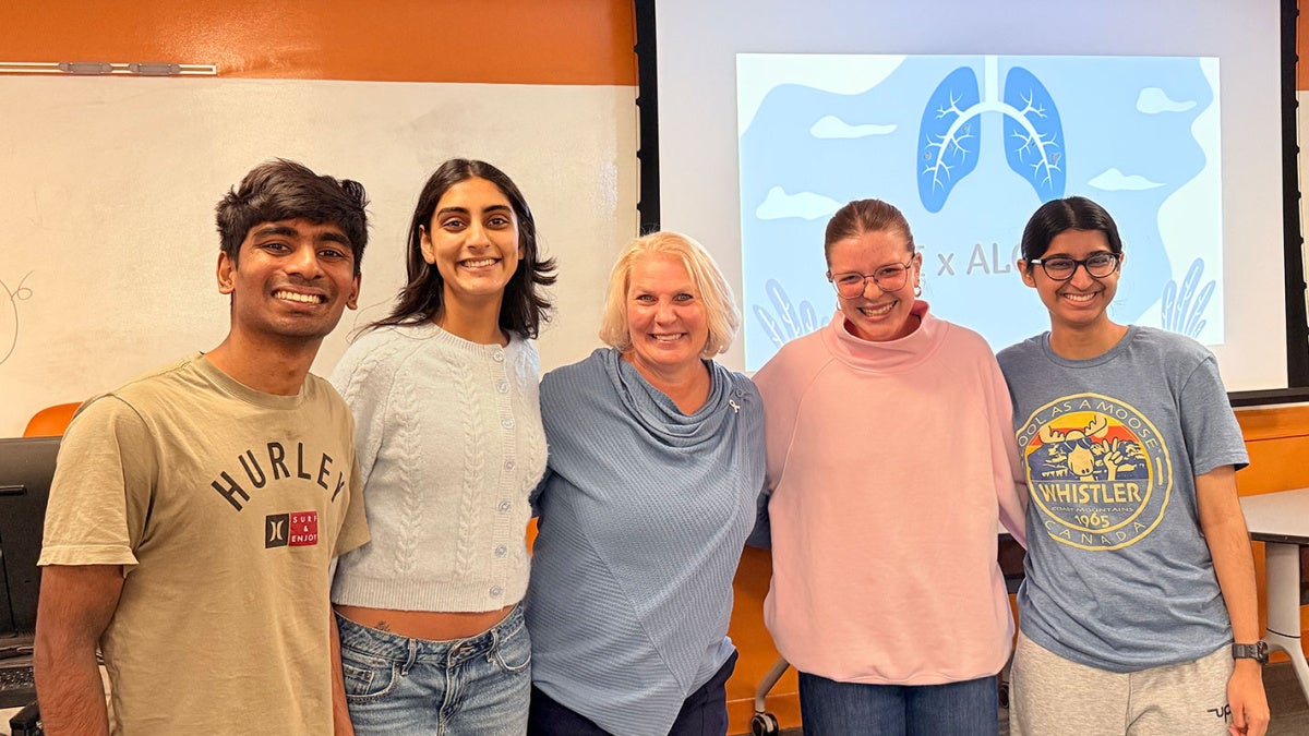 Students with Advocates for Lung Cancer Screening and Intervention pose for a photo with Kelley Sciko, a Stage IV lung cancer patient