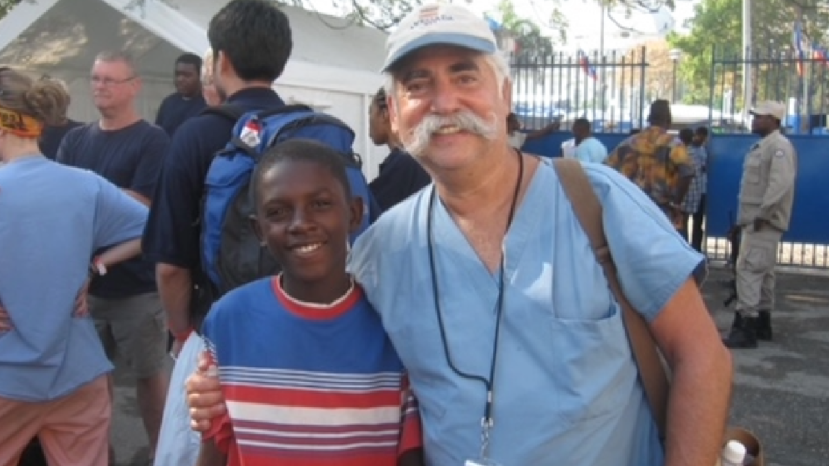 Young man standing next to Dr. Siegel 