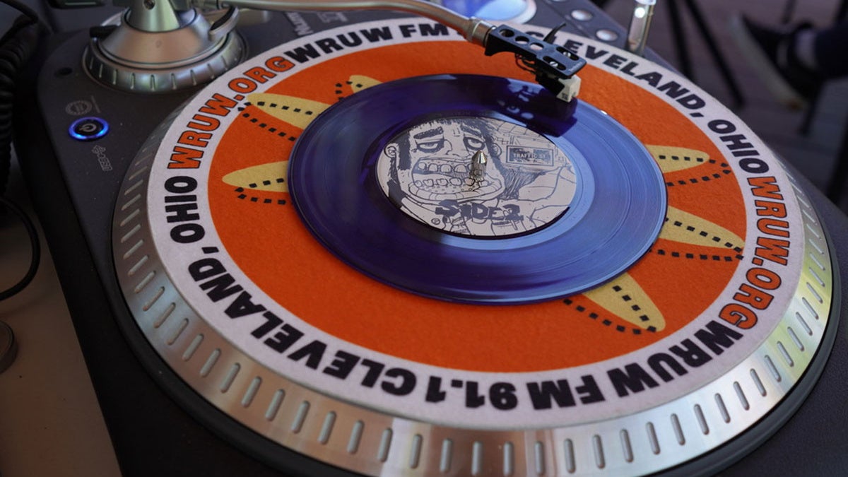 Photo of a WRUW branded turntable in the radio station's studio