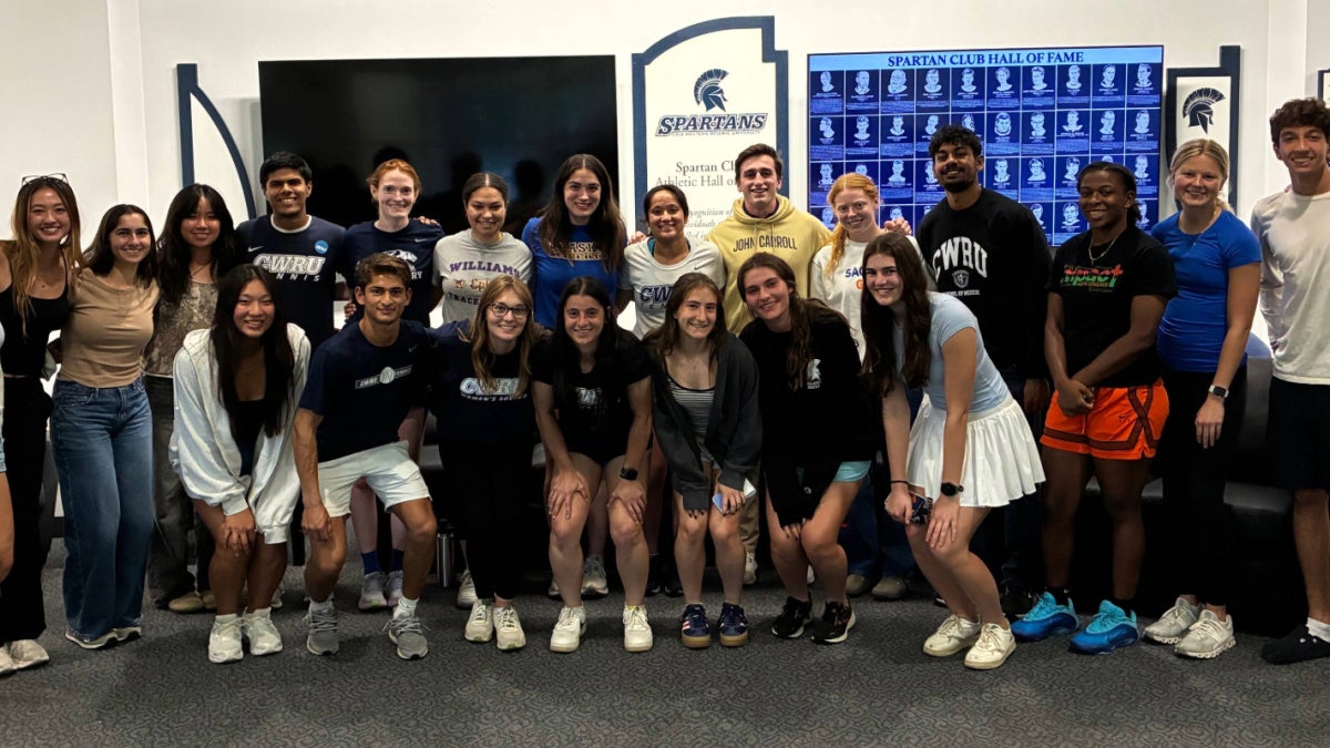 23 students in CWRU AIM posing and smiling together