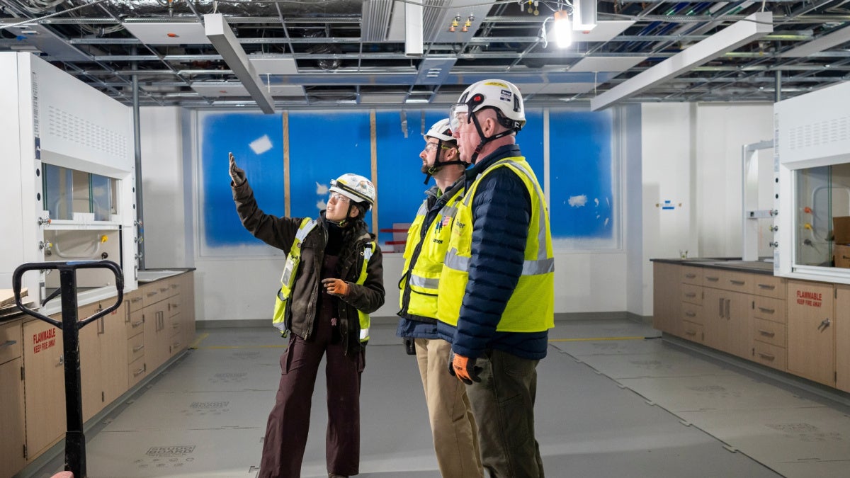 Abigail Mondragon, Philip Polito and Jack Kellogg at the construction site of the Interdisciplinary Science and Engineering Building. Photography by Nancy Andrews.