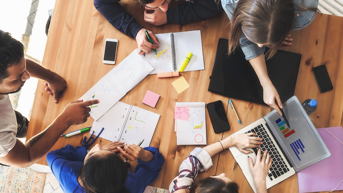 Image of students working together at a table