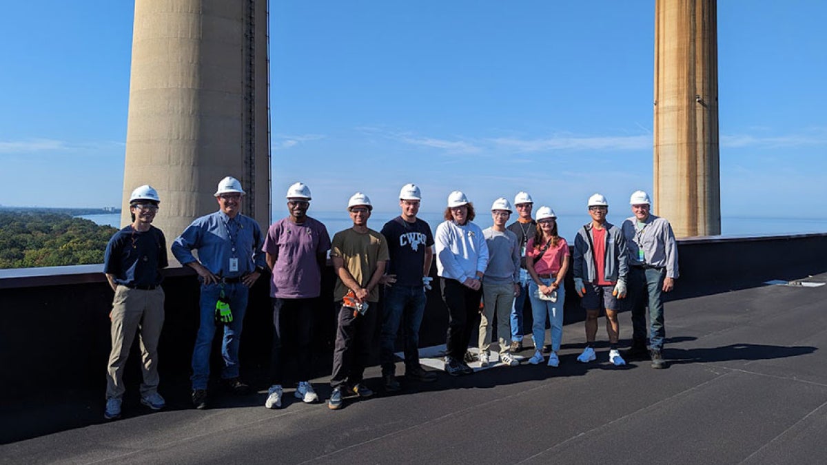 Photo of ThinkEnergy Fellows posing for a photo on a rooftop