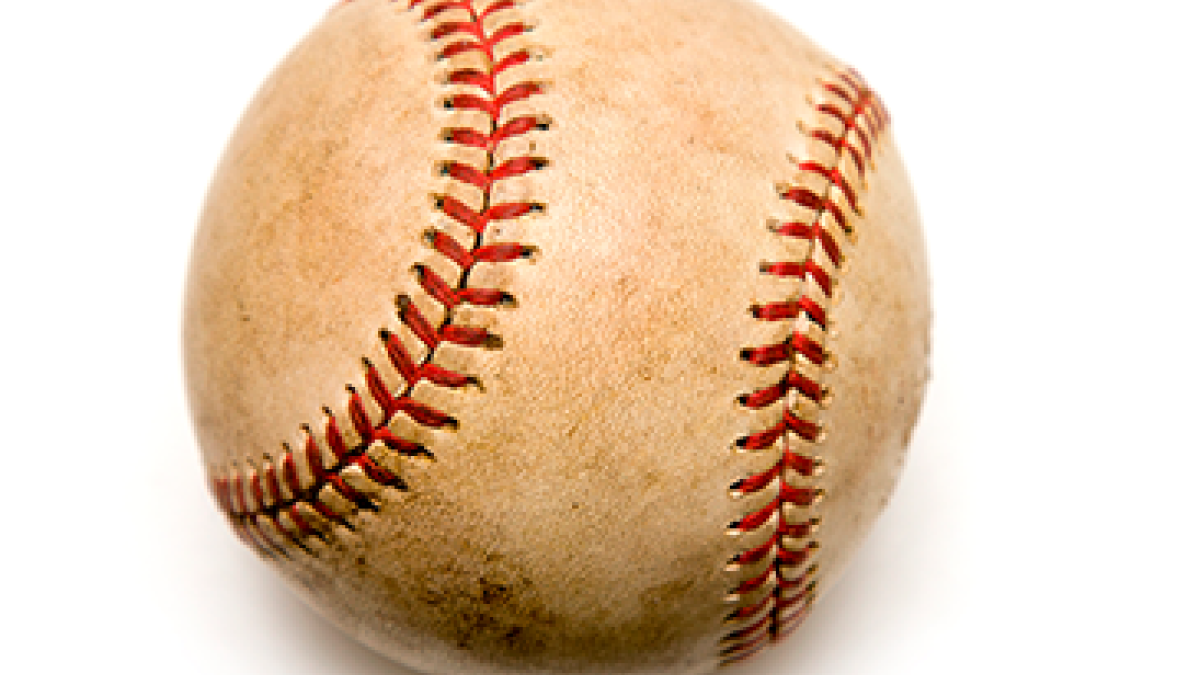 A worn, vintage-style baseball with a cream-colored leather surface showing signs of scuffing and dirt.