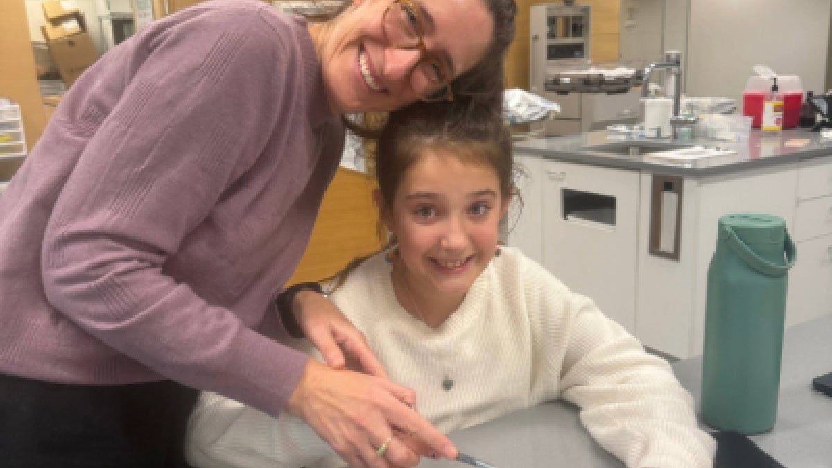 Hedy Leiter practices sutures with a child