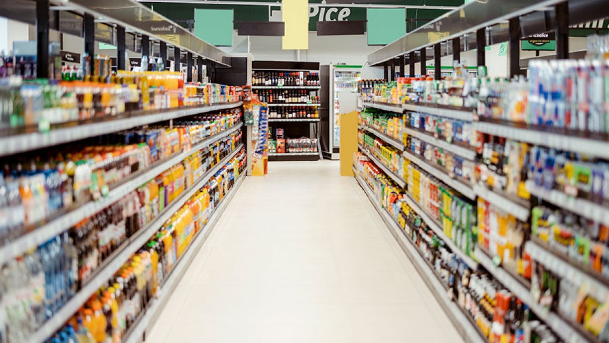 Photo of a beverage aisle in a store with labels blurred