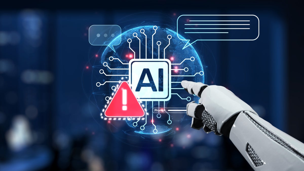 Image of an A.I robot hand pomtimg st warning symbols on a screen