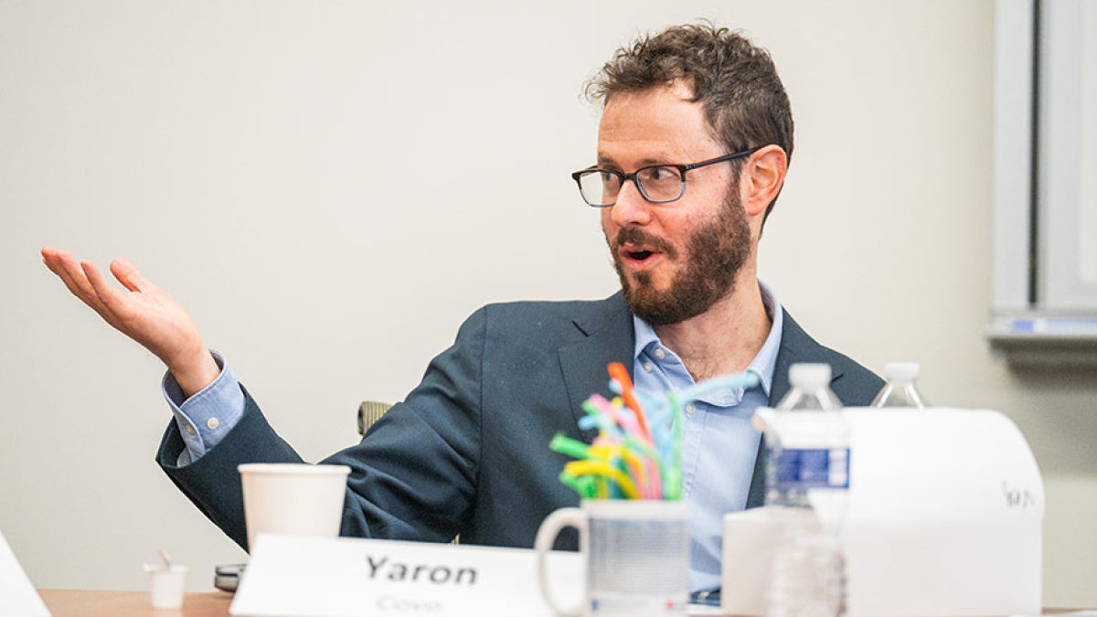 Photo of Yaron Covo speaking while participating in a workshop
