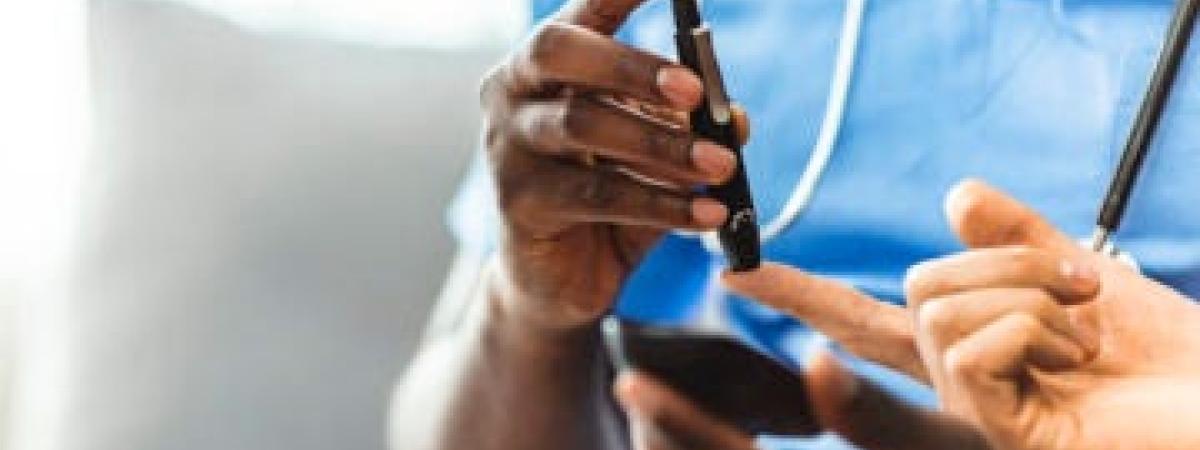 Blood sugar being tested with finger prick