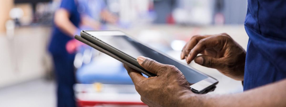 Person holding a tablet