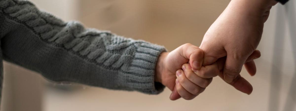 child-hand-hold-feat
