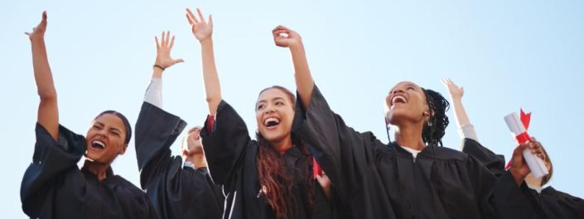 Graduates throwing hats in the air