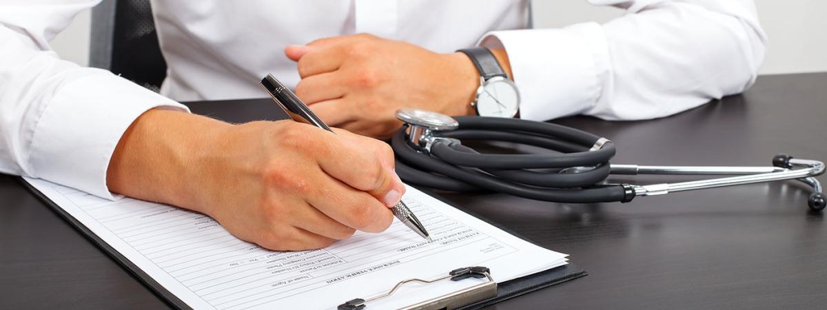 doctor-filling-out-paperwork