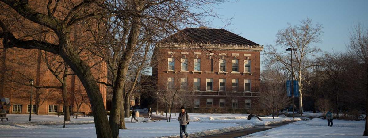 student-walking-snow-feat