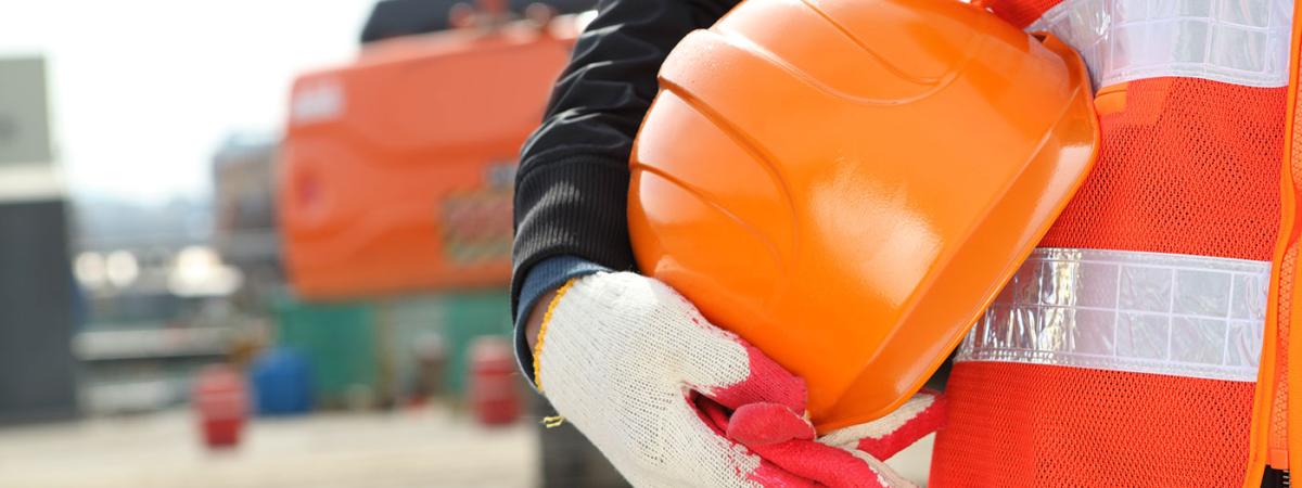 worker-holding-construction-helmet