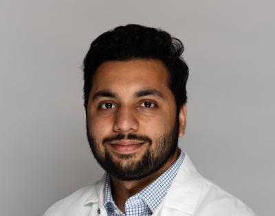 Muhammad Haroon in lab coat