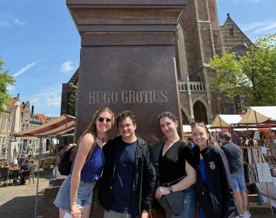 Standing in front of the famed Statute of Hugo Grotius, the Father of International Law, in The Netherlands, from Left to right: Kaylara Benfield, Oliber Bates, Teresa Lebowitz and Maria Blough