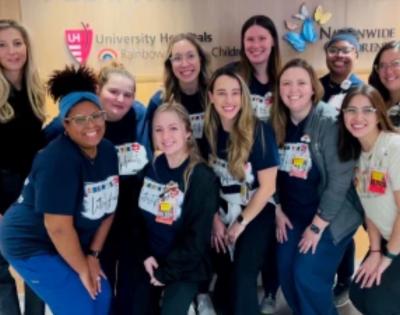 Cristin Coleman and other founding members of UH Rainbow Babies & Children’s Hospital's pediatric cardiac intensive care unit pose for a group photo.