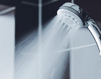 Photo of water spraying from a shower head