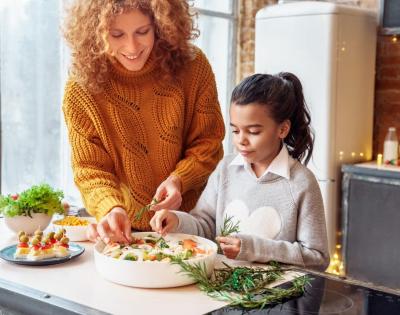 Woman and child making a salad