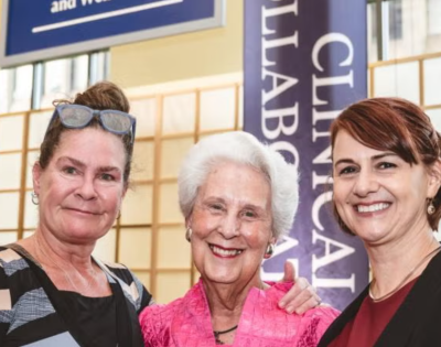 Norah Feeny, Sara Moll and Provost Joy Ward pose for a photo
