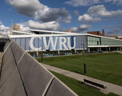 Photo of Tinkham Veale University Center on a sunny day with CWRU signage on the windows