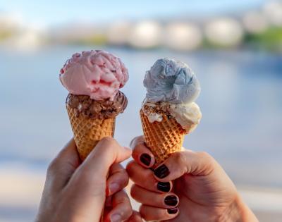 Close up of two ice cream cones.
