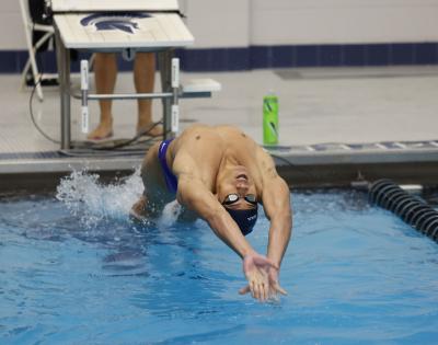 Case Western Reserve University swimmer Emil LaSida does a backstroke start