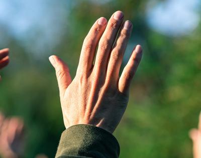 the hands of a religious group
