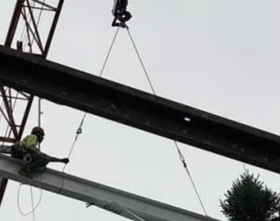 The final beam of the ISEB is lowered into place