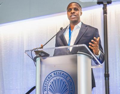 Case Western Reserve University alumnus Kevin Russell speaks at a podium