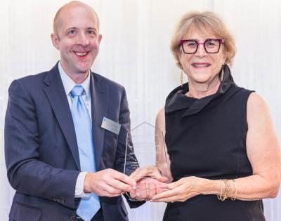 Case Western Reserve University alumni Nicholas Zalany and Judy Strauss-Schwartz pose with an award