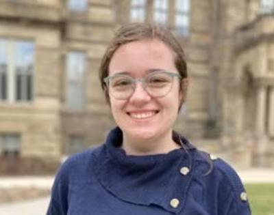 Abbey Murcek headshot in front of Adelbert Hall