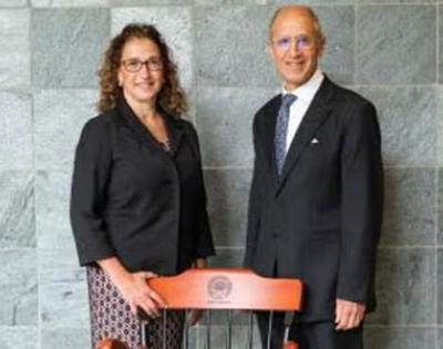 Lia Logio and Stan Gerson pictured in front of her chair