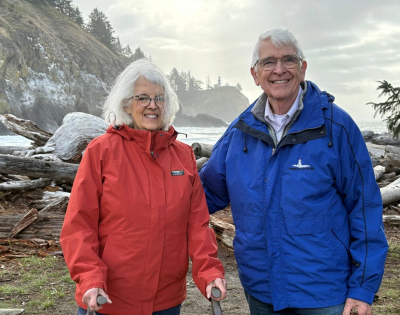 Ed and Melinda Sadar in the mountains wearing winter gear