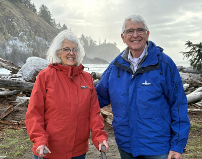 Ed and Melinda Sadar in the mountains wearing winter gear